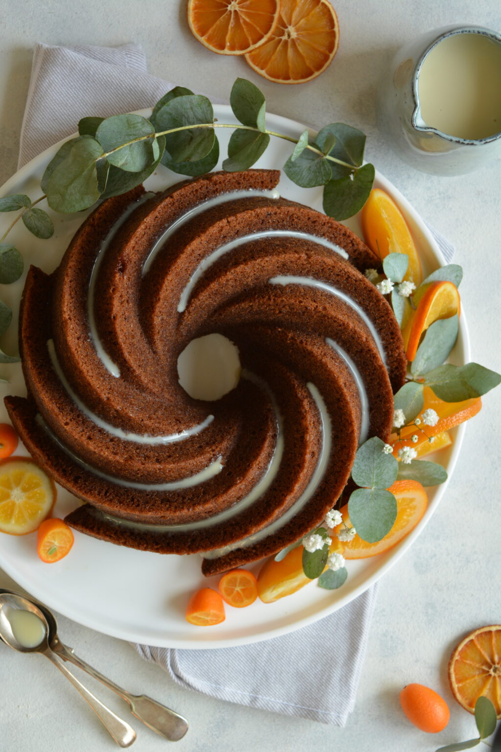 Vegan Christmas Bundt cake with orange and white chocolate icing